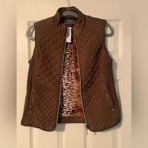 Sleeveless vest . Size Small. Never worn. Bought from boutique .